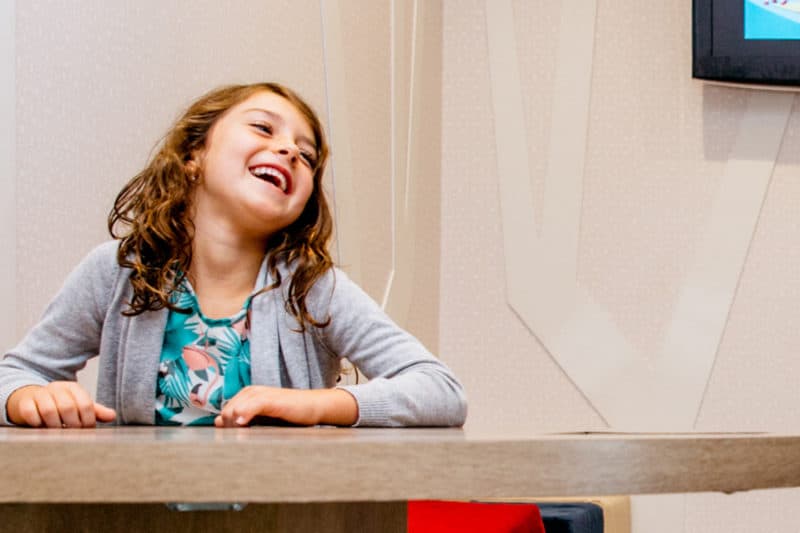 girl playing in the kids corner while she waits for her appointment